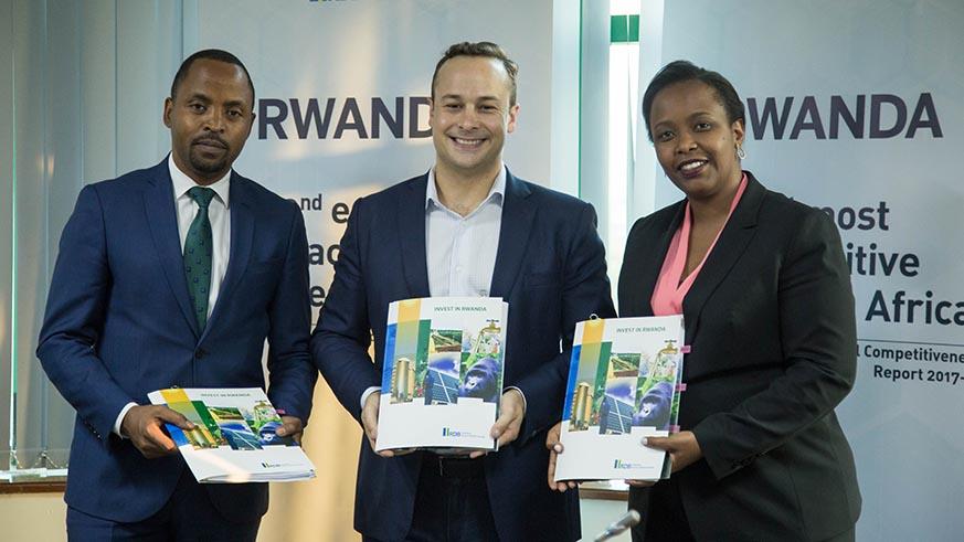 (From L - R) Minister for ITC Jean de Dieu Rurangirwa, Andela CEO Jeremy Johnson and RDB chief executive Clare Akamanzi pose for a photo after the MoU signing ceremony. (Photo Courtesy: Nadege Imbabazi @ The New Times of Rwanda).