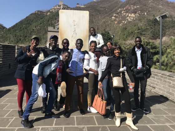The 10 finalists for the 2018 Huawei's seeds for future programs pose for a group photo at the Great Wall of China, in Beijing.