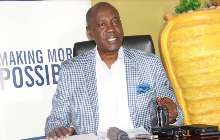 dfcu Limited Chairman of Board, Elly Karuhanga addressing journalists