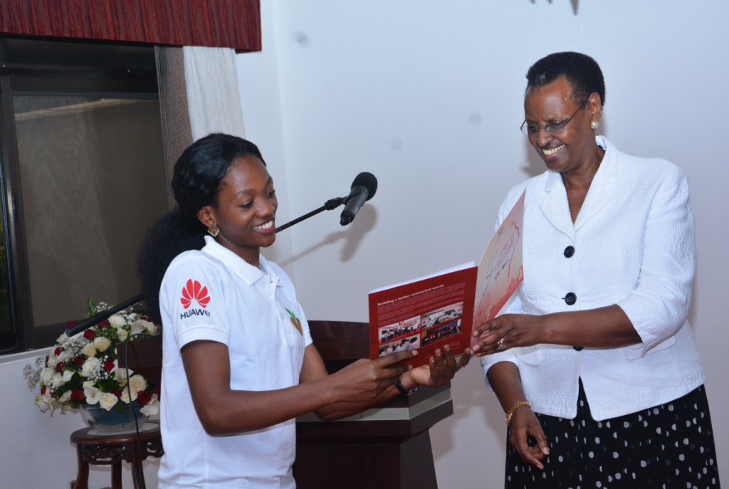 Nakate Annet Mary from Muni University pictured giving the first lady; Janet K. Museveni a copy of the seeds for future program book during the flag off ceremony at the State House on Thursday 29th March, 2018.
