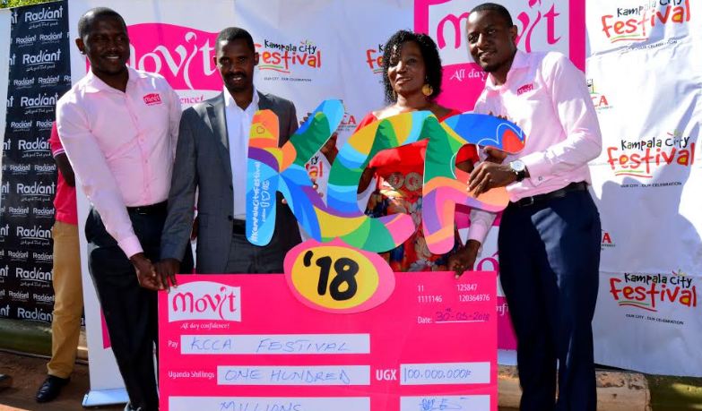 KCCA Executive Director, Jennifer Musisi  poses with a team from Movit. 