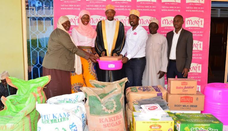 Moslem clerics at Kibuli Mosque receive assorted food stuffs handed over by a team from Movit.