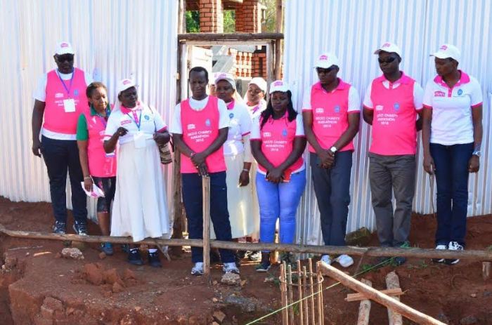 Prince David Wassajja and other officials check on the progress of construction of the Accident Emergecy ward.