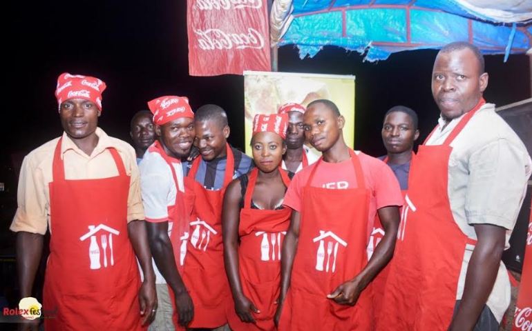 Rolex vendors pose for a group photo during one of the Kampala Rolex festival activations.
