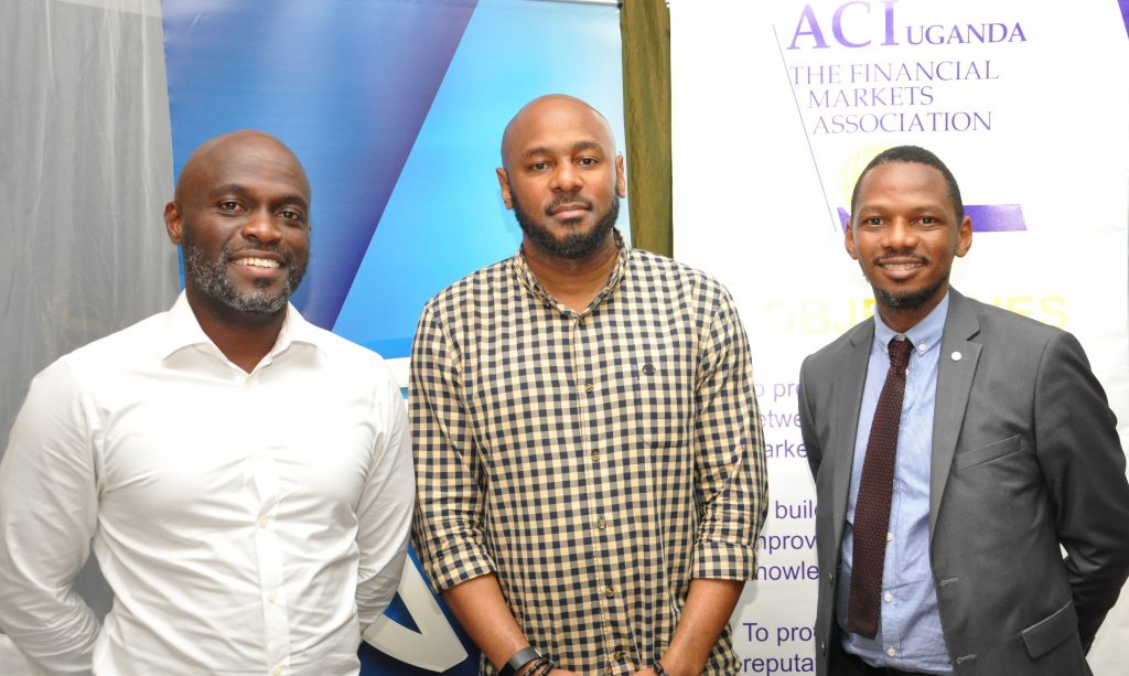 (L-R) Timothy Nkata; Head Forex Trading Bank of Uganda, Benoni Okwenje the ACI Uganda Chairman and Fixed Income Manager at Stanbic Bank, and Alan Norman Lwetabe Assistant Director Financial Markets Bank of Uganda at the ACI Financial Markets forum hosted by Stanbic Bank at the Sheraton Kampala Hotel on Friday 23rd, March 2018.