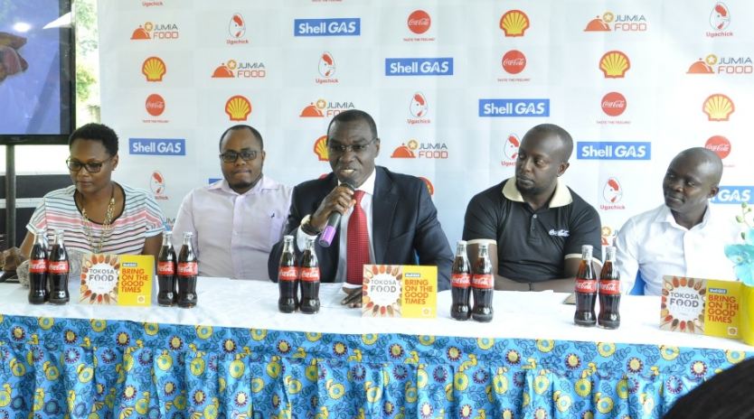 Mr. Gilbert Assi (C), the Managing Director of Vivo Energy Uganda addressing the media.