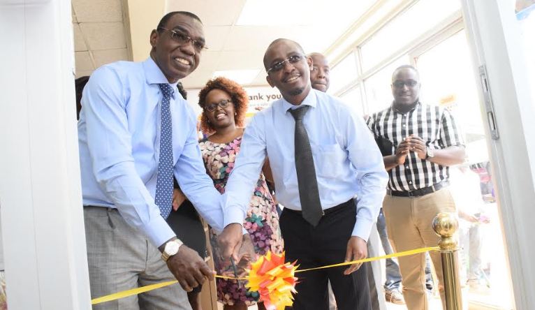 Vivo Energy Managing Director Mr. Gilbert Assi (L) and Goodlife Pharmacy’s CFO Mr. Chris Kieu (R) officially launch the Goodlife pharmacy at Shell Namirembe in the Company of Vivo and Goodlife pharmacy staff.