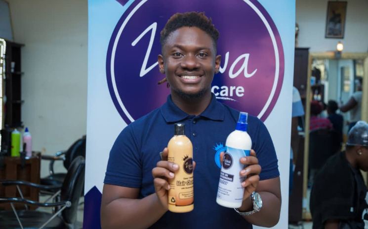 Zziwa Kennedy of Hair by Zziwa salon shows off his new hair products.